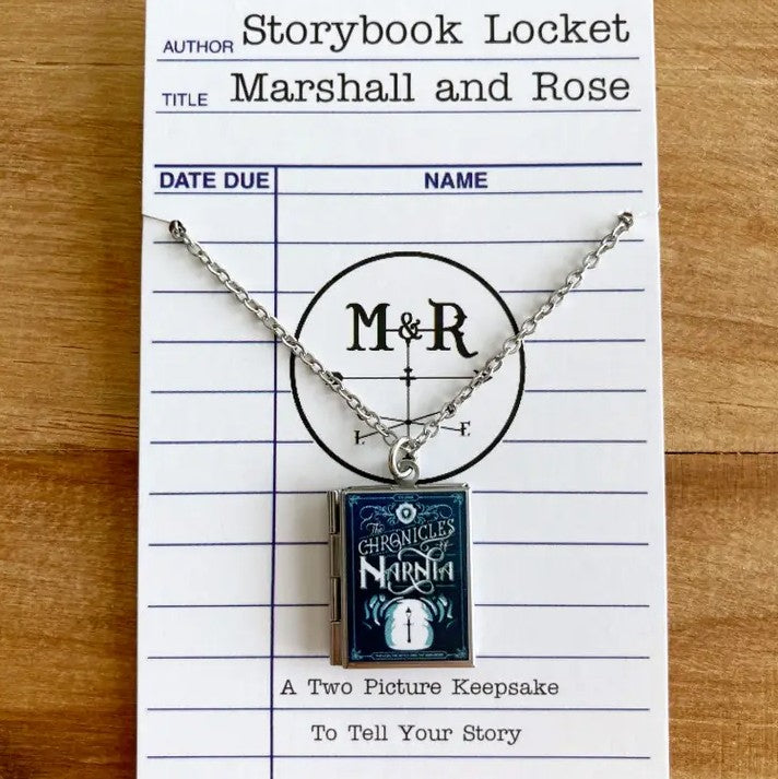 Book-shaped locket necklace featuring the cover art for the book "The Chronicles of Narnia"