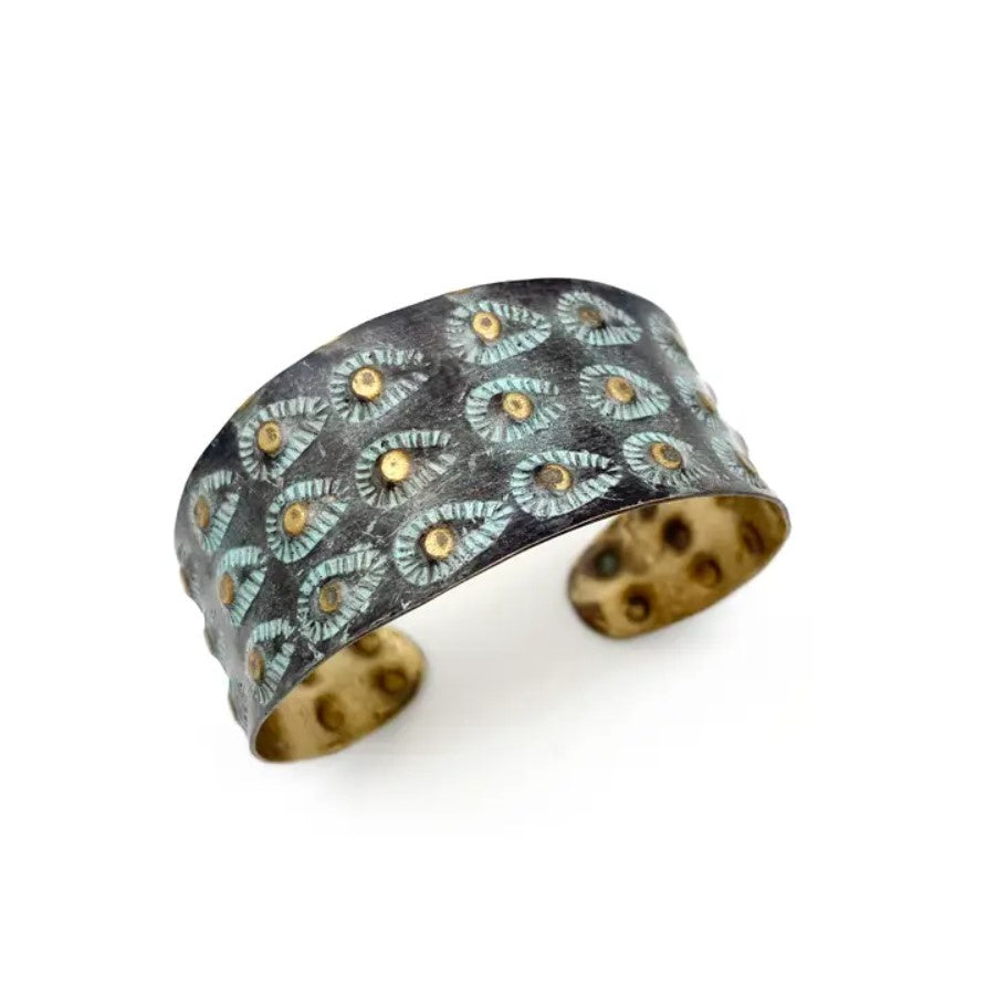 Brass cuff bracelet with a turquoise and brown accent pattern