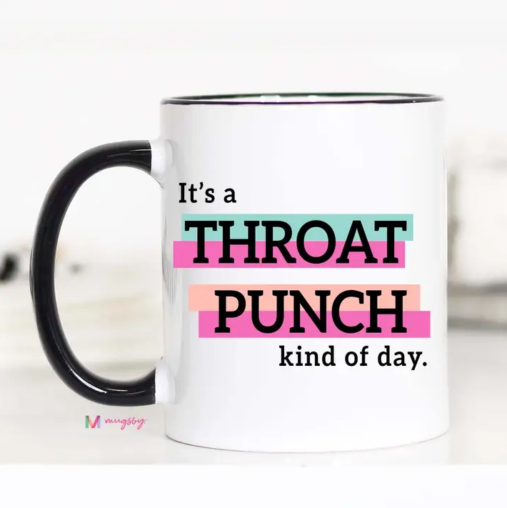 White mug with a black handle and black text in front of a blue, pink and peach background. The text reads "It's a throat punch kind of day."