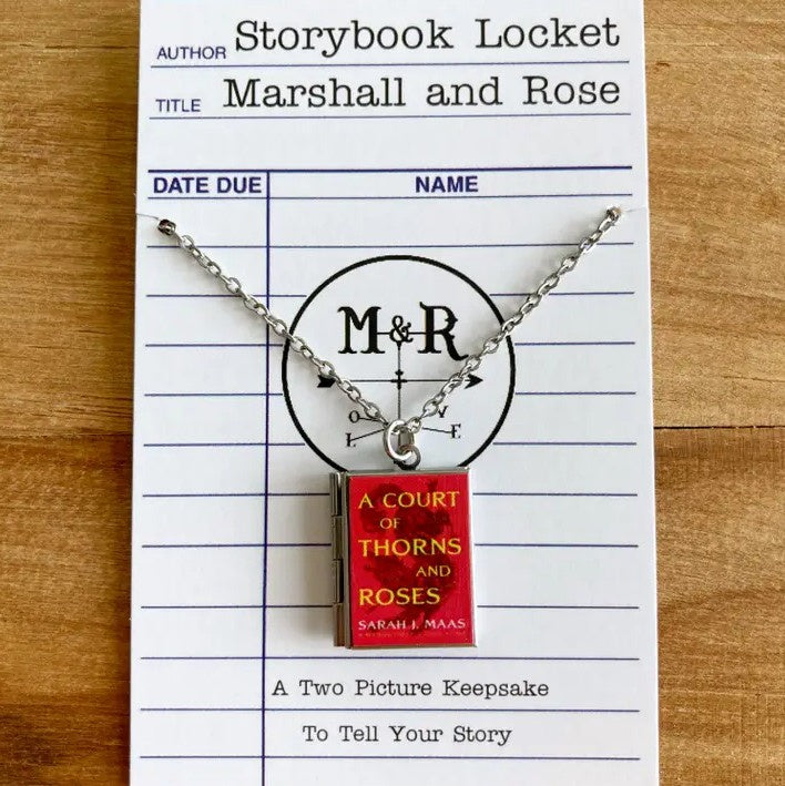 Locket with a red pendant shaped like the book "A Court of Thorns and Roses"