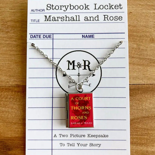 Locket with a red pendant shaped like the book "A Court of Thorns and Roses"