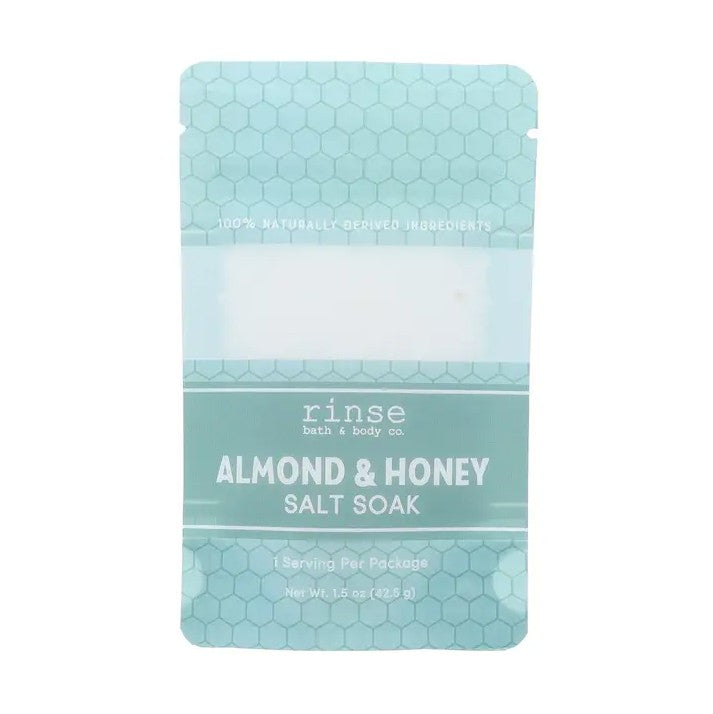 Teal packet of almond and honey scented salt soak