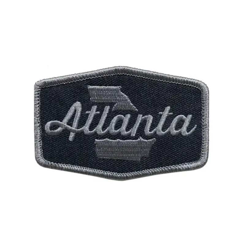 Black and gray fabric patch that says "Atlanta"