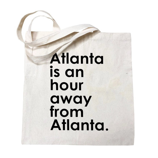 tan tote bag with text in black that says atlanta is an hour away form atlanta