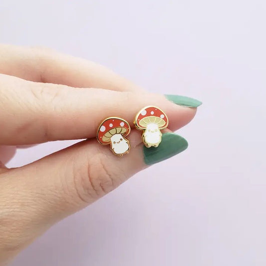 Stud earrings shaped like smiling little mushrooms