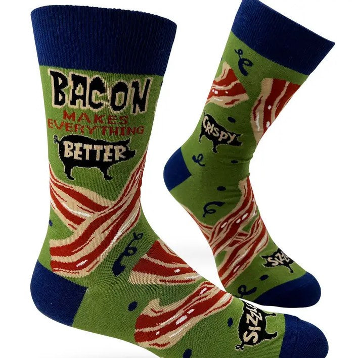 Bright green calf socks decorated with strips of bacon and silhouettes of pigs, with the words "Bacon Makes Everything Better" at the top.