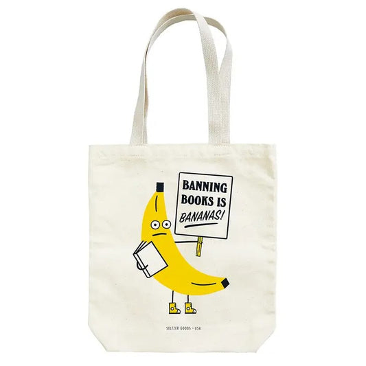 Tote Bag with artwork of a banana holding a book and a sign that states "Banning Books is Bananas!"