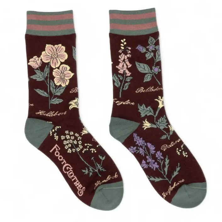 Dark brown calf socks decorated with various poisonous flowers.
