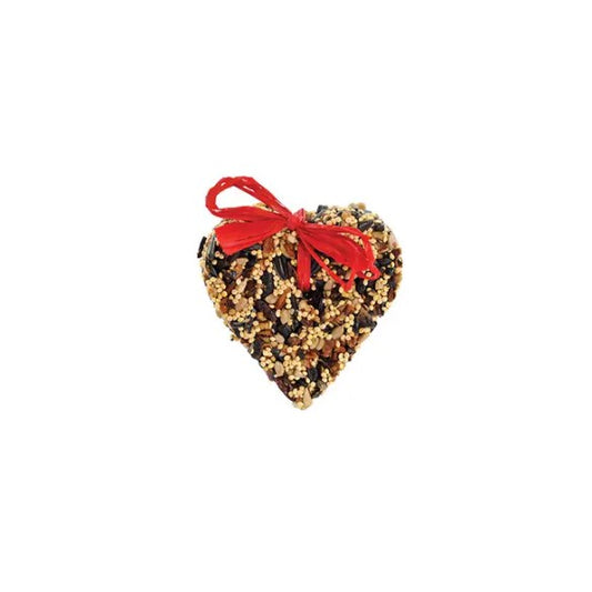 A small heart shaped bird treat made of fruits, nuts and seeds.