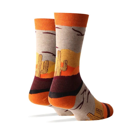 Pair of socks with a cactus and bird pattern on the back