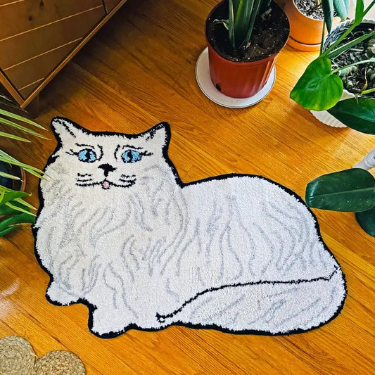 Small white area rug shaped like a Persian cat on a wood floor
