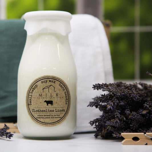 milk bottle candle next to fresh lavender