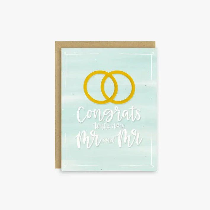 Light green greeting card with an image of interlocked golden rings and white cursive font that reads "Congrats to the new Mr. and Mr."