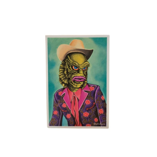 Magnet depicting the Creature from the Black Lagoon in a colorful suit and cowboy hat