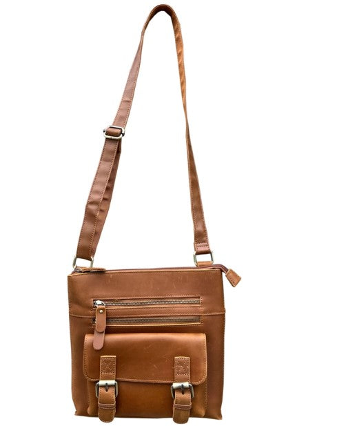 Tan leather crossbody bag with two zippered pockets and a buckled compartment on the front