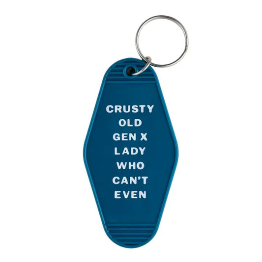 Blue keychain with white lettering that reads "Crusty old gen x lady who can't even"