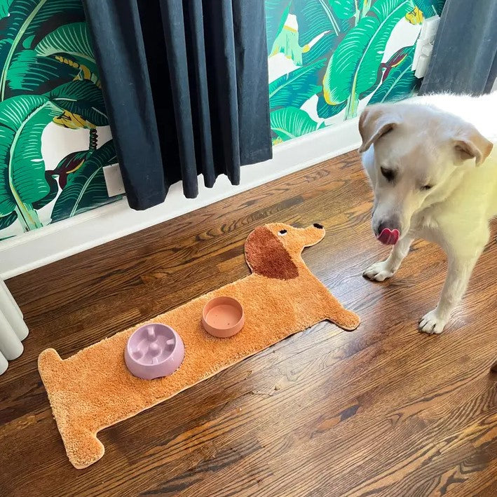 Small light brown rug in the shape of a Dachshund dog