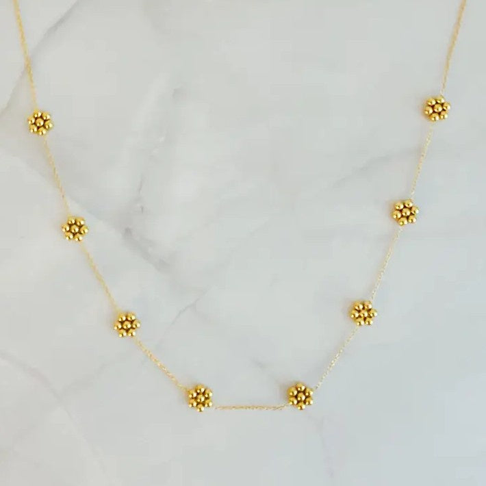 Gold necklace with small gold bead flowers