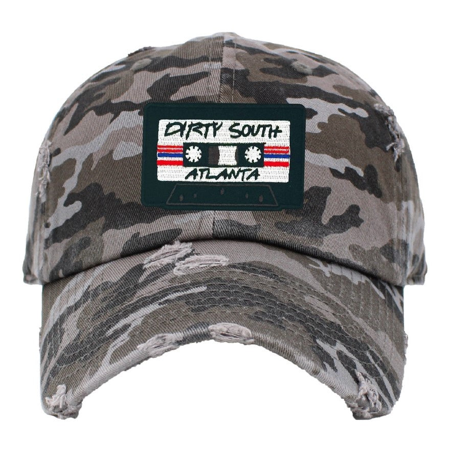 camo hat with a cassette patch that reads Dirty South Atlanta