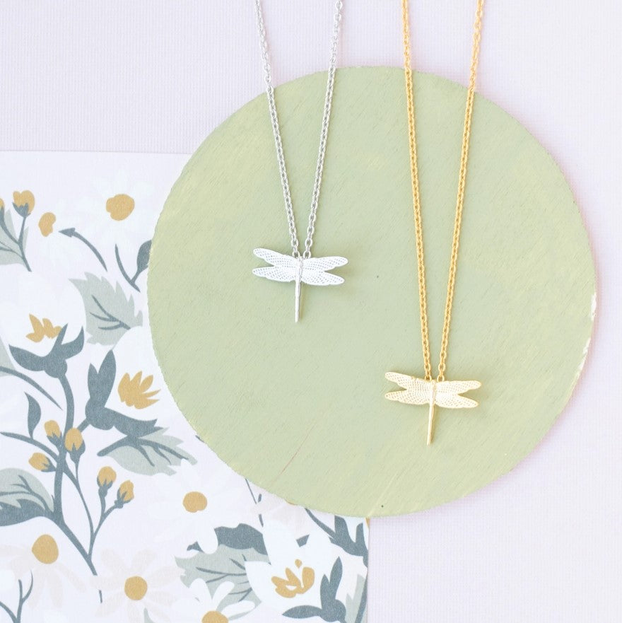 Necklace available in gold or silver featuring a small dragonfly pendant