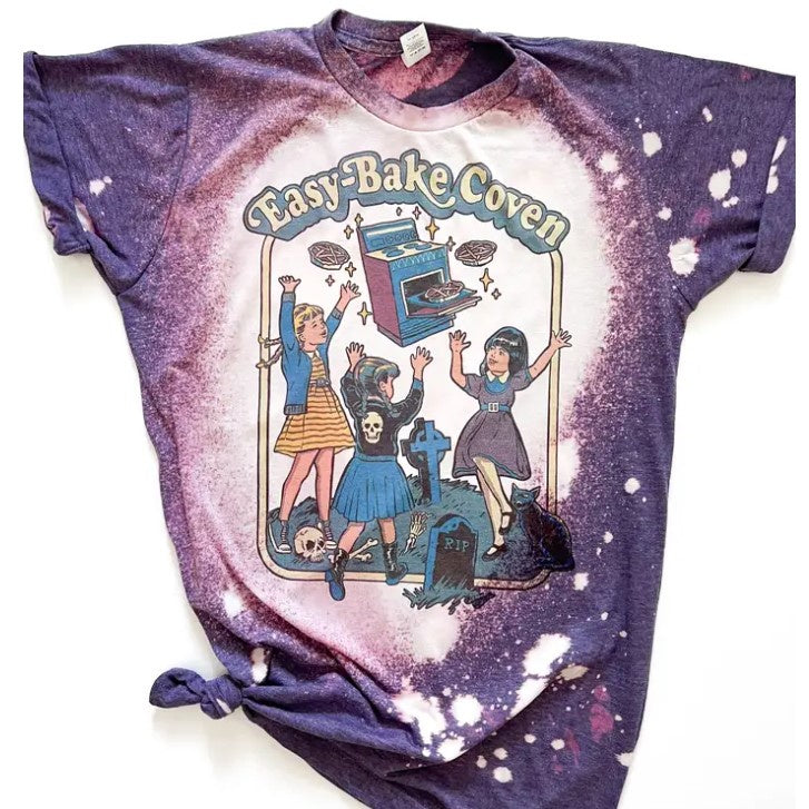 purple tie dyed shirt with easy bake coven (like easy bake oven) and little girls worshipping it