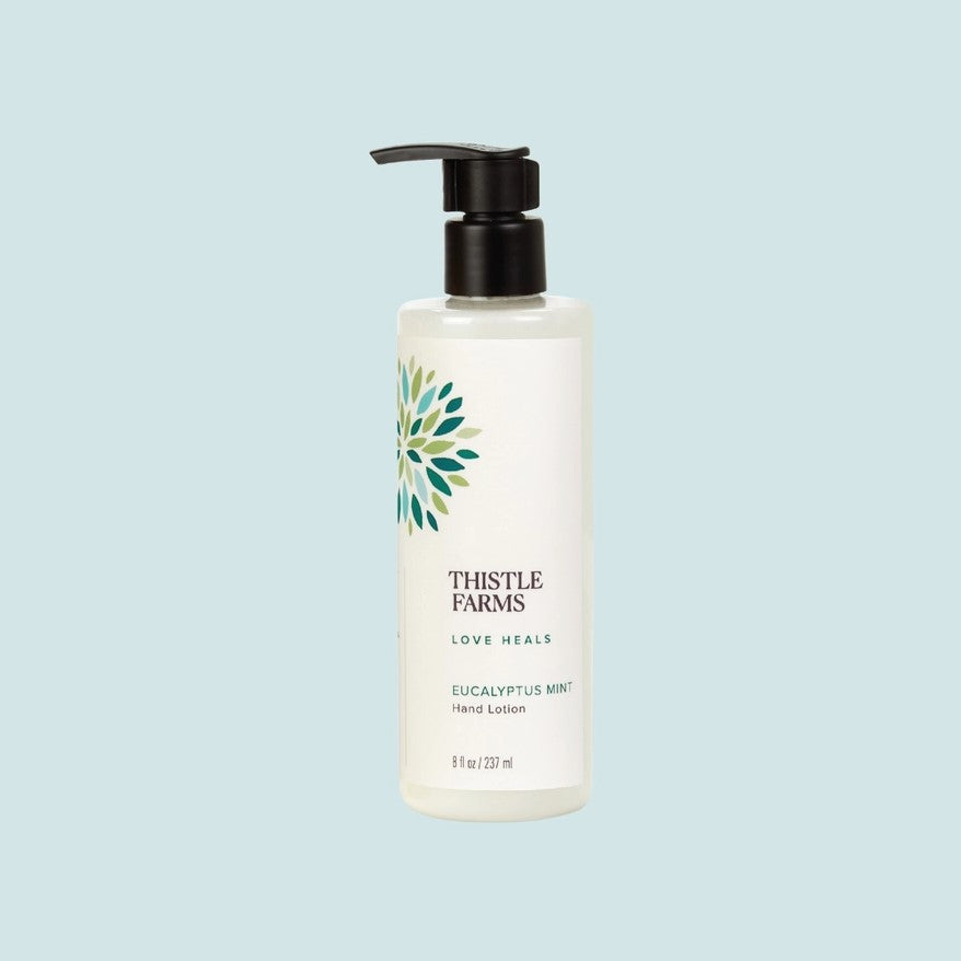Eucalyptus mint scented hand lotion in a pump bottle with the slogan "Love Heals"