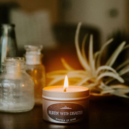 Four ounce soy wax candle titled "Flirtin' with Disaster."