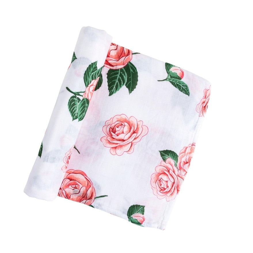 Partially unfolded floral swaddle baby blanket