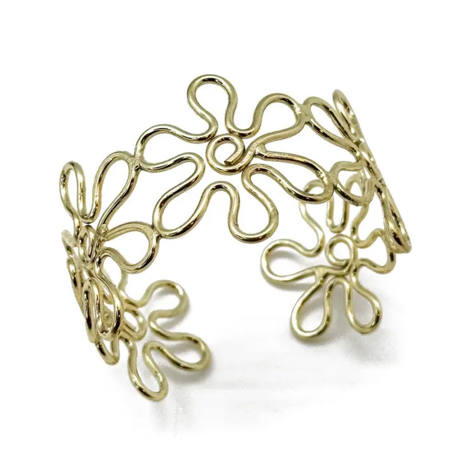 Gold adjustable cuff bracelet shaped like loopy connected flowers