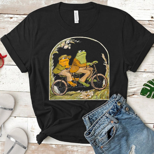 Black Shirt featuring Frog and Toad riding a bike