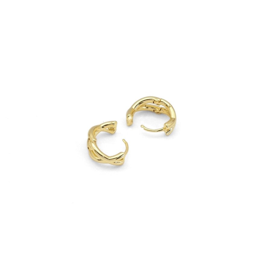 Small gold earrings with a criss cross pattern on the hoops