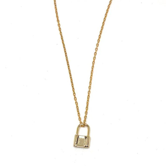 Gold necklace with a small gold lock-shaped charm