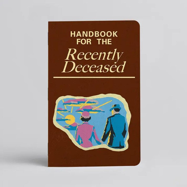 Brown notebook with an illustration of a man and woman holding hands, titled "Handbook for the Recently Deceased"