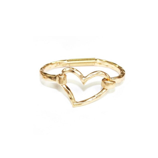 Gold cuff bracelet with an asymmetrical heart at the center