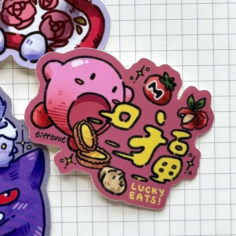 A sticker featuring Kirby inhaling several tarts and a tomato on a pink background
