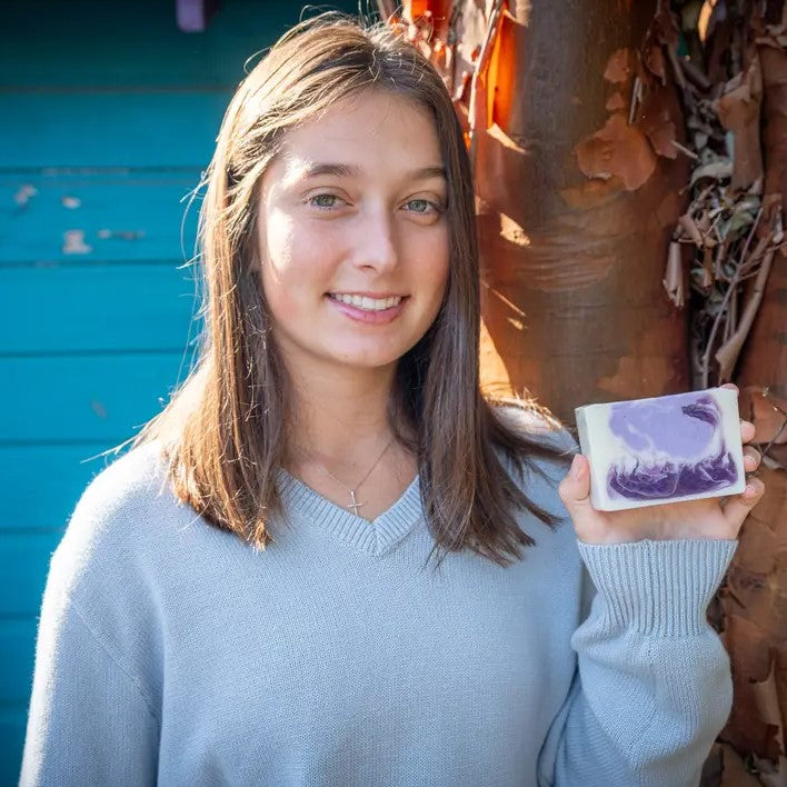Five ounce lavender scented bar soap with a white and purple organic swirl pattern