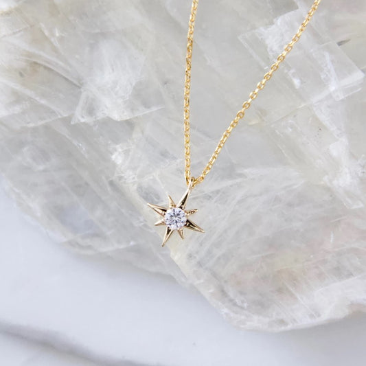 white crystal inset a gold star charm necklace