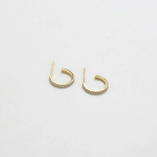 Small gold hoop earrings with tiny clear gemstones