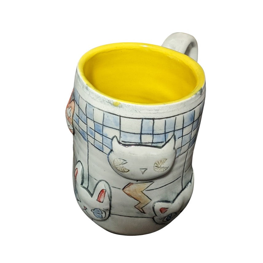 inside of a mug by artist molly makes critters