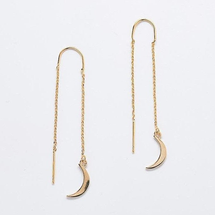 Dangling chain gold earrings with a crescent shaped charm