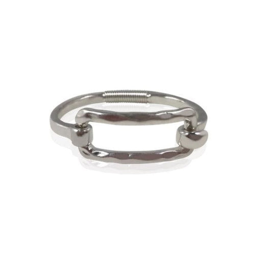 A silver-tone metal cuff bracelet with a large rectangular buckle-style clasp