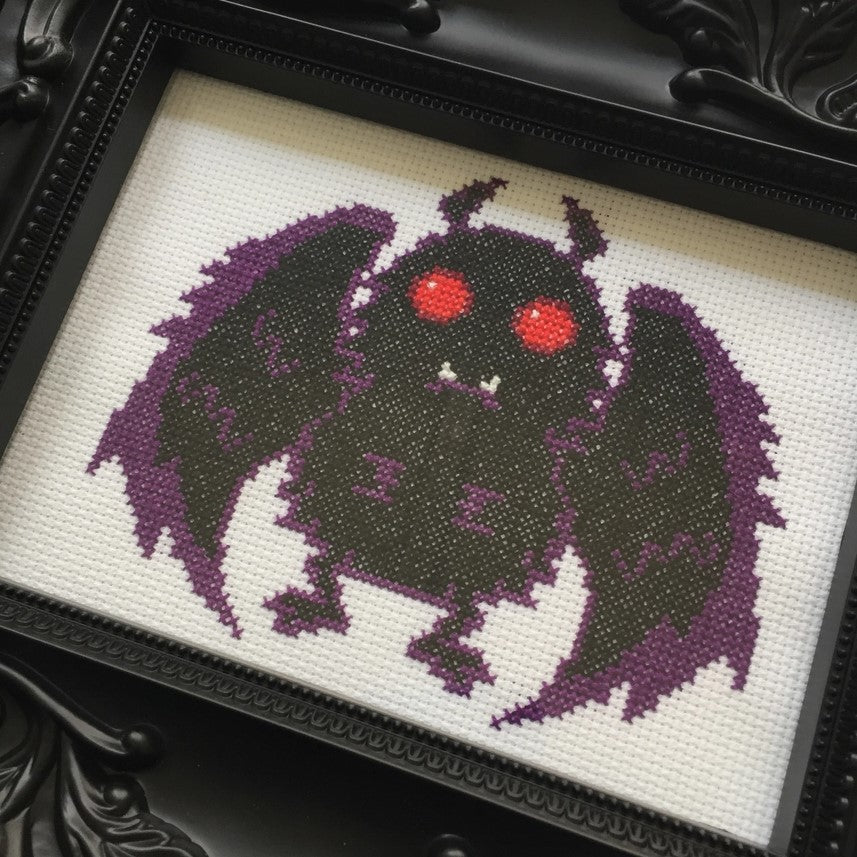 mothman cross stitch framed