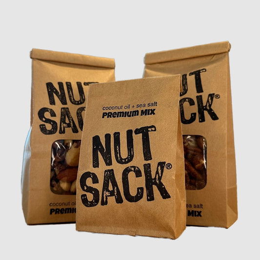three kraft bags of nuts for snacking