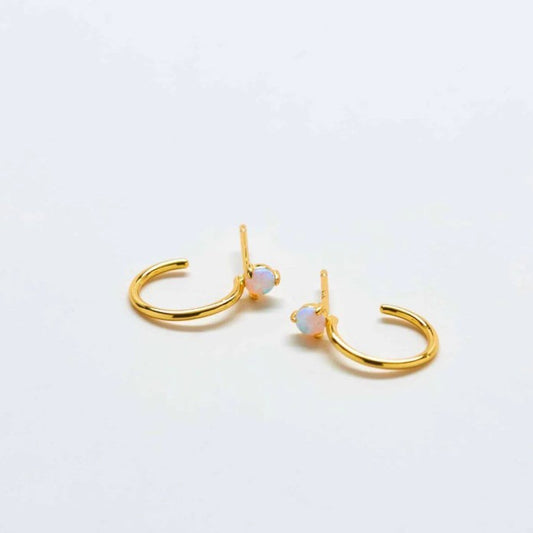 Small gold hoop earrings with small opal studs at the top