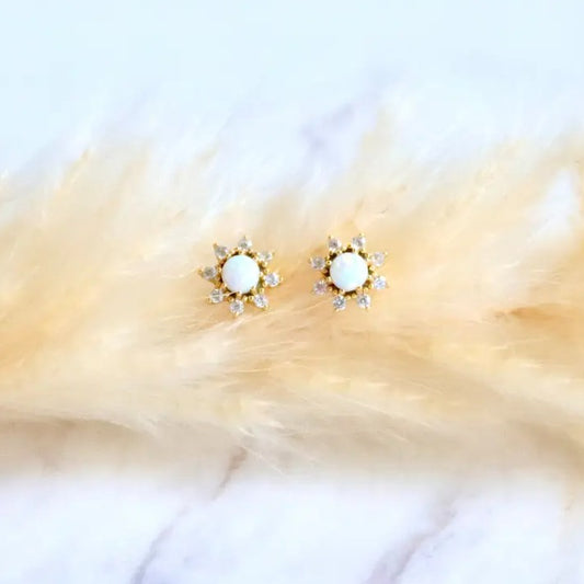 Pair of flower-shaped stud earrings with opal centers