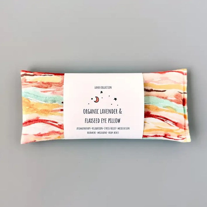 Organic lavender and flaxseed eye pillow in a red, yellow and blue watercolor striped pattern