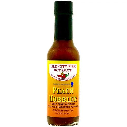 Five fluid ounce bottle of peach and habañero hot sauce.