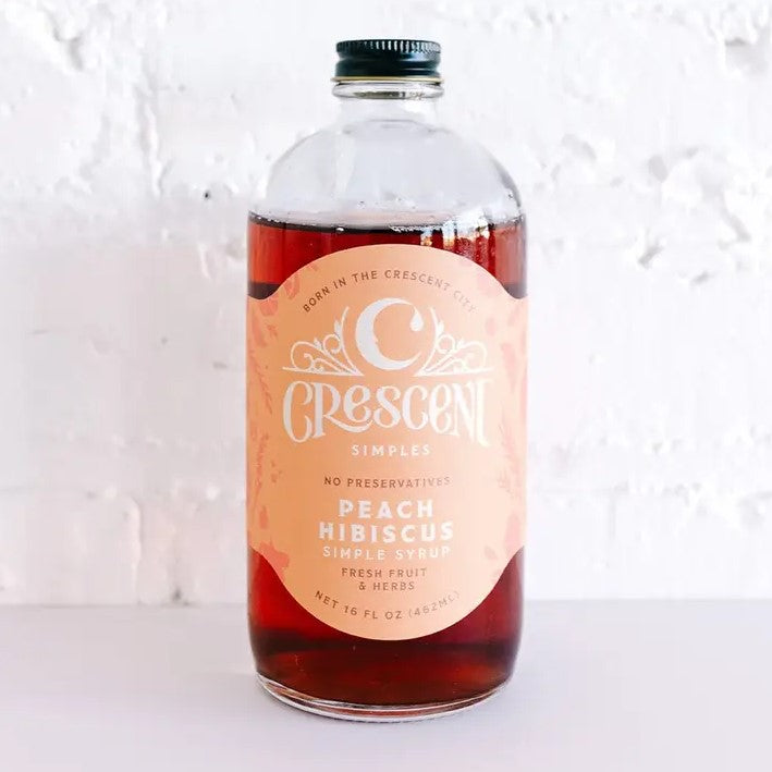 Sixteen fluid ounce bottle of peach hibiscus simple syrup