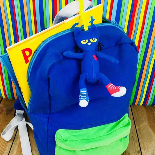 Backpack with a blue Pete the Cat keychain on the zipper