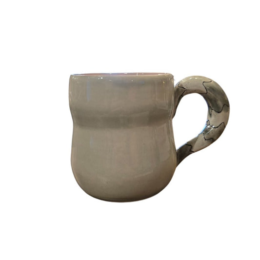 Back of raccoon shaped pottery mug